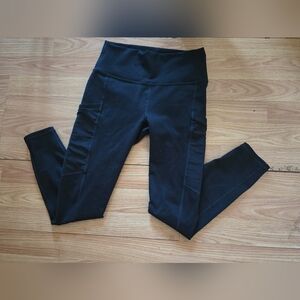 Fabletics Women's Powerhold High-Waisted Leggings in Black with Pockets,Size S